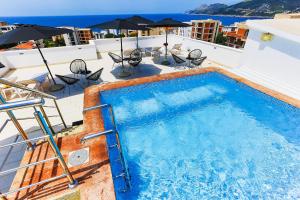 a swimming pool on the roof of a building at Apartmani BLUE MOON in Dobra Voda