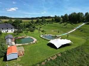 an aerial view of a farm with two ponds at Apartmány Horka in Kamenná Horka