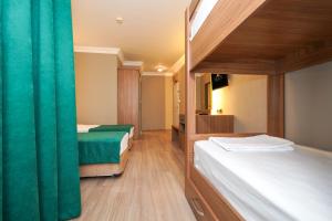 Postel nebo postele na pokoji v ubytování ERGÜN OTEL