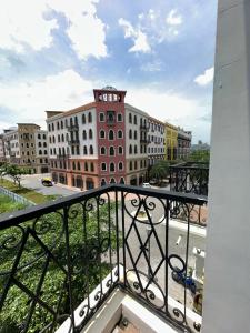 a view of a building from a balcony at VĨNH KHANG HẠ LONG HOTEL in Ha Long