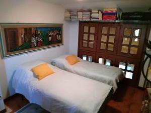 Postel nebo postele na pokoji v ubytování Casa delle orchidee
