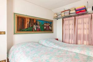 Postel nebo postele na pokoji v ubytování Casa delle orchidee