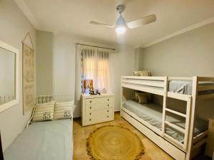 Postel nebo postele na pokoji v ubytování Apartamento Urbanización Los Albatros Isla Canela + 13 fotografií