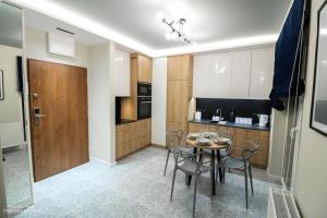Kuchyňa alebo kuchynka v ubytovaní D Apartments Centrum Woda