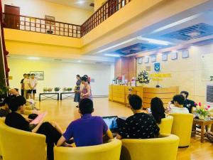 a group of people sitting in chairs in a room at Khách Sạn Hoàng Mấm Minh Cầu - Best City view in Thái Nguyên