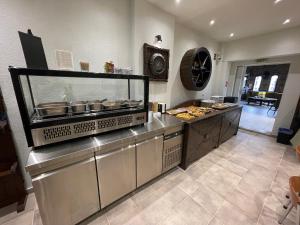 Kuchyň nebo kuchyňský kout v ubytování Samel Hotel