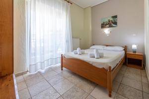 Postel nebo postele na pokoji v ubytování Lucia Hotel Paralia + 37 fotografií