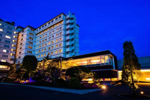 a hotel at night with a building at HAKODATE Uminokaze in Hakodate