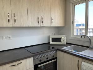 Kuchyň nebo kuchyňský kout v ubytování Apartamento mejor zona de Gandia