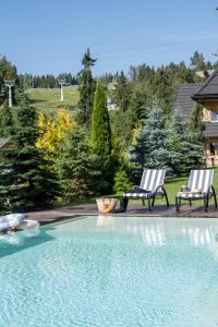 Bazén v ubytování Domki w Białce WOODHOUSE- basen, sauna, jacuzzi nebo v jeho okolí