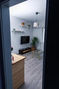a living room with a table and a tv at Presidential neighbour retreat in Sofia