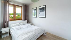 Posteľ alebo postele v izbe v ubytovaní Wonder Home - Apartamenty z balkonami, blisko centrum Karpacza, stoku i aquaparku