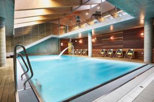 Bazén v ubytovaní VacationClub Royal Tulip Sand Apartament 309 alebo v jeho blízkosti