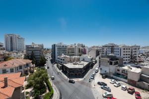 an aerial view of a city with buildings at Rise Urban Art Hotel in Larnaca