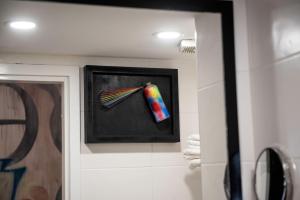 a painting of a colorful pen on a wall at Rise Urban Art Hotel in Larnaca