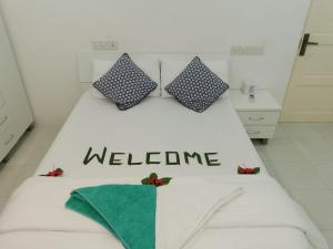 Letto o letti in una camera di Palm Gate Maldives