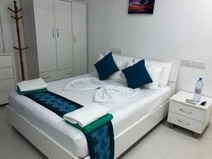 Letto o letti in una camera di Palm Gate Maldives