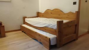 a wooden bunk bed in a room with wooden floors at Montchavin la Plagne N10 in La Plagne Tarentaise