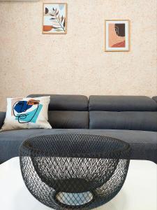 a living room with a couch and a coffee table at Art Sense Мезонет in Shkorpilovtsi