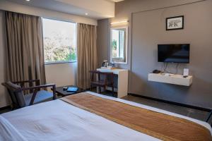 Hotel Dwarawata客房内的一张或多张床位