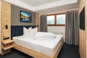 Postel nebo postele na pokoji v ubytování Ferienresidenz Raich - Appartements mit Sky Wellness und Garten