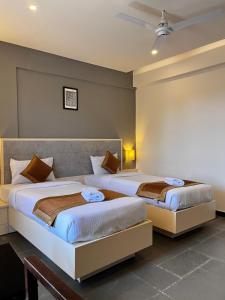 Hotel Dwarawata客房内的一张或多张床位
