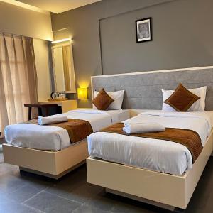 Hotel Dwarawata客房内的一张或多张床位