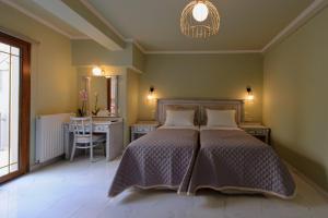 Postel nebo postele na pokoji v ubytování Parga Inn Suites