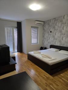 Voodi või voodid majutusasutuse Apartments Philip II toas