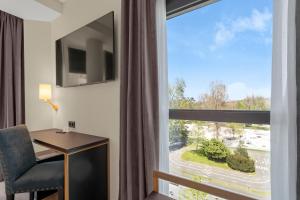 TV a/nebo společenská místnost v ubytování Hotel Zentral Gijón Rey Pelayo