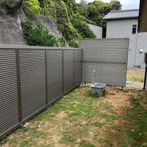 a privacy fence with a toilet in a yard at KAI 勝浦 Chiba in Katsuura +11 photos
