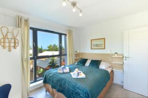 Posteľ alebo postele v izbe v ubytovaní Apartamenty Horyzont SeaView by Rent like home