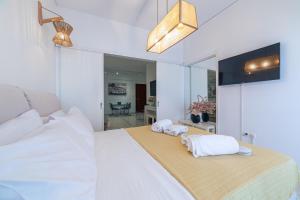 Posteľ alebo postele v izbe v ubytovaní L'appartement blanc dans le centre de Glyfada