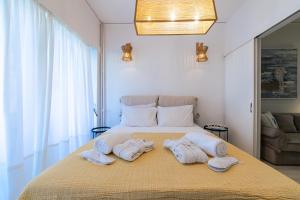 Posteľ alebo postele v izbe v ubytovaní L'appartement blanc dans le centre de Glyfada