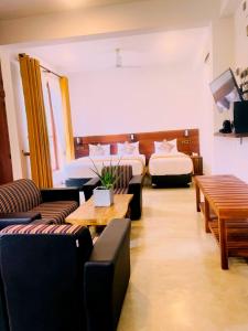 Postel nebo postele na pokoji v ubytování Ceylon Ayu Resort Kandy
