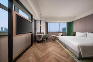 Postel nebo postele na pokoji v ubytování Holiday Inn Shijiazhuang High-tech Zone by IHG