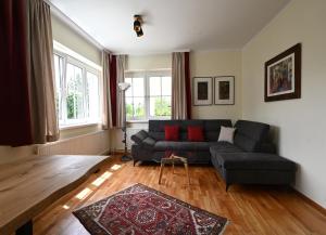 a living room with a couch and a table at Ferienwohnung 208 in Mönichkirchen +6 photos
