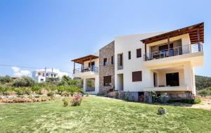 a view of a house with a yard at House Rytha in Limenaria