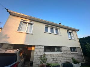 a house with a car parked in front of it at Maison cosy 600m de la gare de Rambouillet in Rambouillet