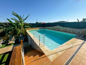 a swimming pool on top of a house at Casa de Aloe in Albufeira