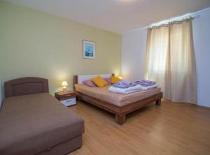 Posteľ alebo postele v izbe v ubytovaní Apartments Bonic