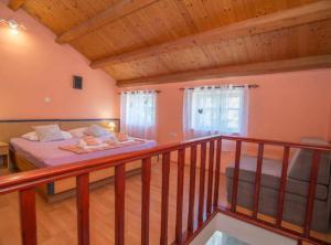 Postel nebo postele na pokoji v ubytování Apartments Bonic + 18 fotografií
