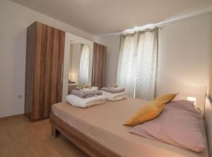 Posteľ alebo postele v izbe v ubytovaní Apartments Bonic