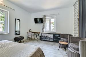 Et tv og/eller underholdning på Captain' s Villa Boutique Hotel