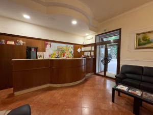 a lobby with a reception desk and a waiting room at Hotel Villa Robinia in Genzano di Roma