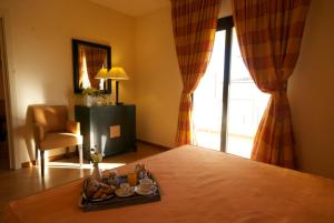Postel nebo postele na pokoji v ubytování Mahara Hotel & Wellness