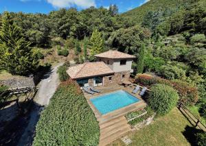 an aerial view of a house with a swimming pool at Les Brugas de Camias in Saint-André-de-Majencoules