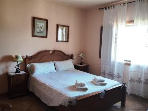 a bedroom with a bed with two towels on it at Finca Sa Gruta Marines in S'Illot +31 photos