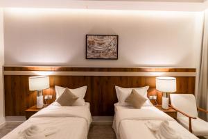 Voodi või voodid majutusasutuse Wassad Hotel Makkah فندق وسد مكة toas
