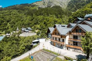 an aerial view of a village in the mountains at Large private chalet in Vaujany in Vaujany